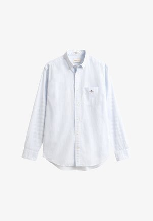 Niebiesko-biała koszula w paski z długim rękawem, kołnierzykiem na guziki, kieszenią na lewej piersi i małym logo na kieszeni. Materiał bawełniany.