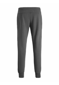 Gray sweatpants featuring a soft texture, elastic waistband, and tapered legs with ribbed cuffs, designed for comfort and mobility.
