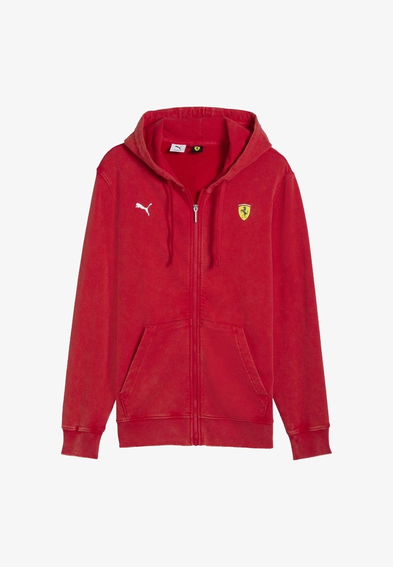 Felpa rossa con zip realizzata in tessuto morbido. Presenta una tasca a marsupio, toppe con logo, polsini a costine e un cappuccio con coulisse.