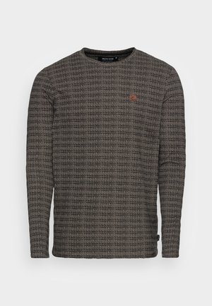 Long-sleeve dark gray textured sweater with horizontal striped pattern and small round brown logo patch on left chest.
