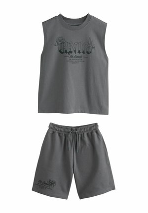Sleeveless dark gray top with "Unity No Limits" text and floral design paired with matching elastic waist shorts with drawstring and similar text.