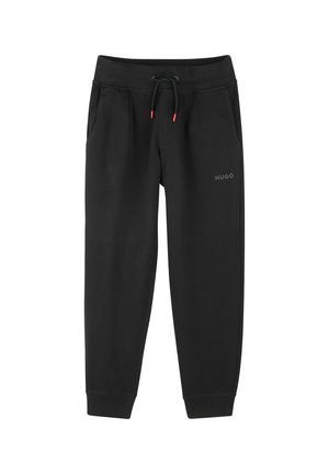 Pantalon de survêtement noir en tissu doux, avec cordon de serrage ajustable, poches et logo HUGO discret sur le devant.