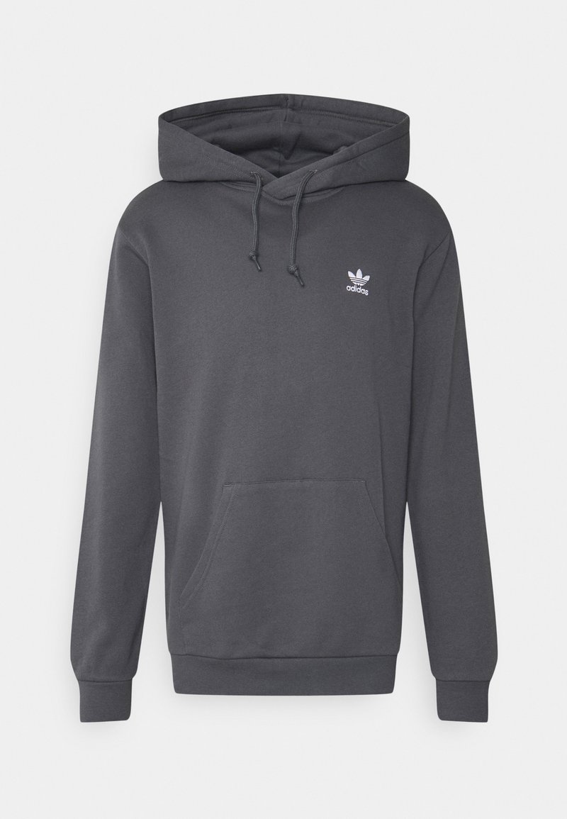 Šedá mikina s kapucí a klokaní kapsou, s žebrovanými manžetami a spodním lemem. Na hrudi má malé bílé logo Adidas. Příjemně měkký materiál.