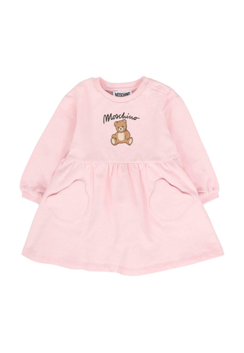 Abito rosa con maniche lunghe, scollatura rotonda, caratterizzato da una grafica di un orsetto e due tasche circolari. Realizzato in tessuto morbido.