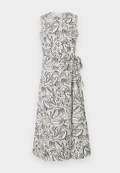 Λευκό μίντι φόρεμα χωρίς μανίκια με μαύρο αφηρημένο μοτίβο φύλλων και πλευρική υφασμάτινη ζώνη δεμένη στη μέση.