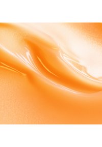 Pomarańczowy, błyszczący teksturą z gładkimi, falującymi falami i subtelnym blaskiem, przypominający żel lub balsam.