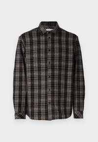 Chemise à carreaux noir et beige à manches longues, boutonnée, avec col et poignets à boutons, présentée sur un fond blanc.