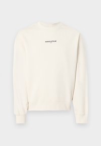 Sweat-shirt à manches longues et col ras-du-cou de couleur blanc cassé avec le texte "MAISON KITSUNÉ PARIS" imprimé en noir sur la poitrine.