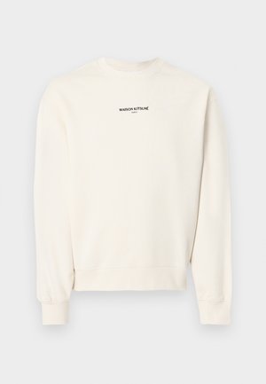 Kreemikas maani varrukatega ümar kaelusega dressipluus, mille rinnal on musta värviga trükitud tekst "MAISON KITSUNÉ PARIS".