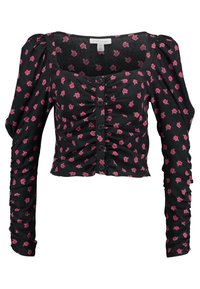 Blusa nera a maniche lunghe, corta, con stampa di rose rosa, davanti arricciata, chiusura a bottoni e spalle a sbuffo.
