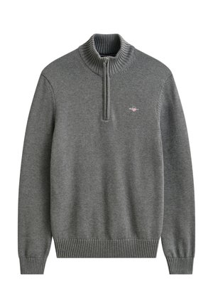 Hall kootud pullover, millel on soonikkoes varrukasäärised ja alumine äär, neljandiku pikkune lukuääris ja väike vasakul rinnal tikitud logo.