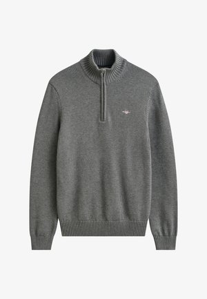 Hall kootud pullover, millel on soonikkoes varrukasäärised ja alumine äär, neljandiku pikkune lukuääris ja väike vasakul rinnal tikitud logo.