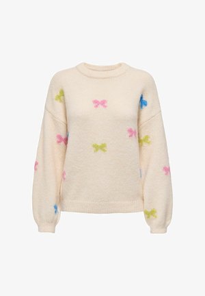 Crème-kleurige trui met een gestructureerde afwerking, featuring kleine meerkleurige strikpatronen in roze, groen en blauw doorheen.