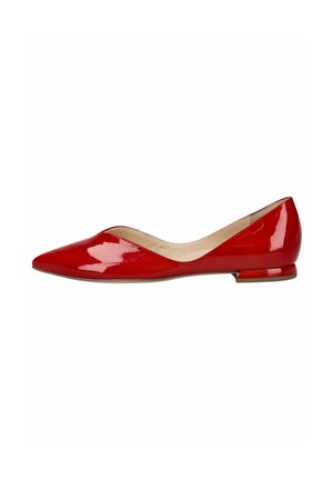 Red patent leather pointed-toe flat shoe with low heel and beige interior lining, shown in side profile on white background.