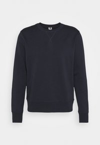 Sweat-shirt bleu marine foncé à col rond avec manches longues, poignets et ourlet côtelés, et un détail triangulaire cousu sous le col.