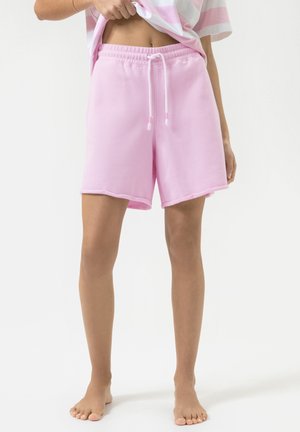 Lichtroze sweatshorts met een elastische tailleband, verstelbaar trekkoord en een zachte textuur. Heeft een licht gebogen zoom.