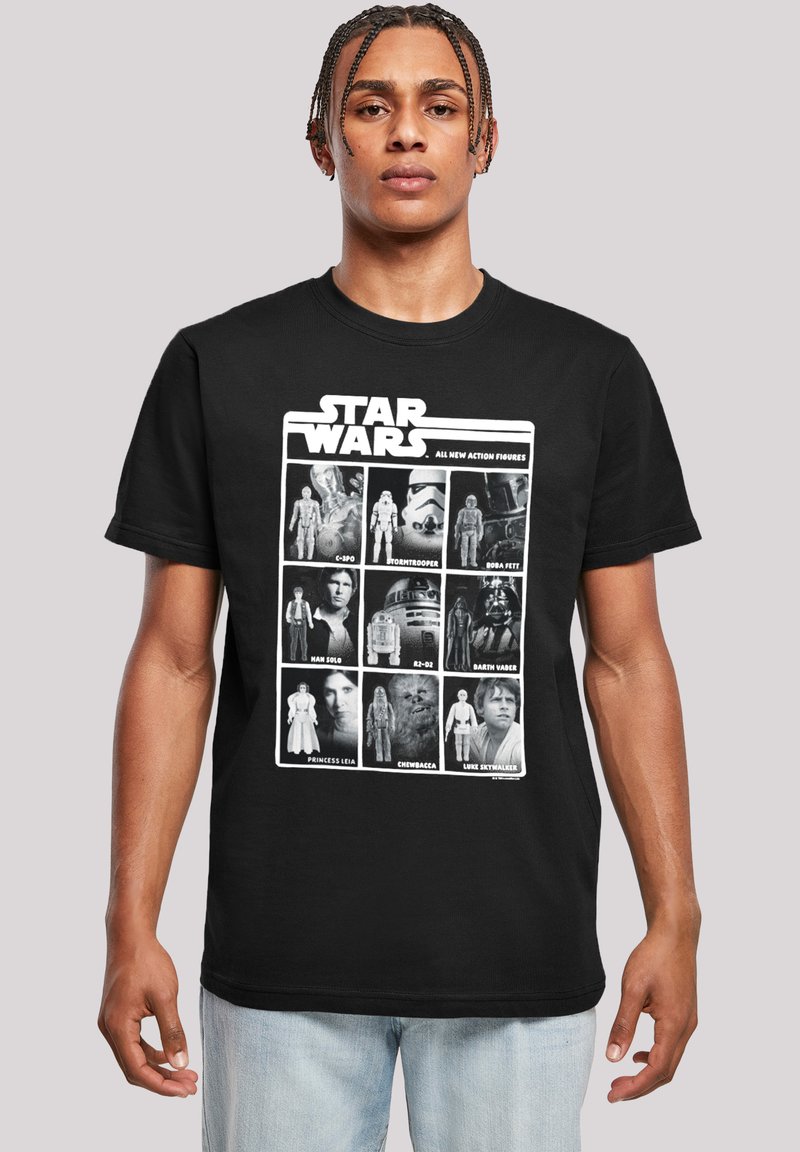Svart bomull t-skjorte med hvit grafikk av Star Wars-karakterer i et rutenettoppsett, med teksten "STAR WARS" øverst. Korte ermer, rund hals.