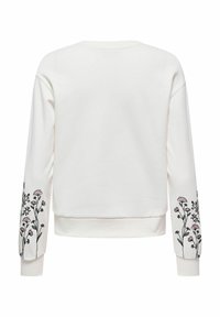 Sweat-shirt blanc avec broderie florale rose et verte sur les deux manches. Texture douce avec une coupe décontractée et des poignets côtelés.