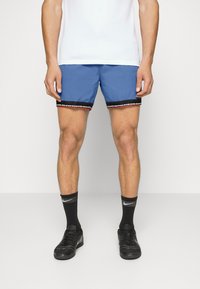 Nike Performance Pantalón corto de deporte - blue