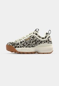 Leopard print sneaker with a white mesh upper, beige accents, and a brown rubber sole. Features a cushioned tongue and lace-up design.