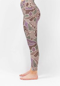 Leggings made of stretchy fabric in earthy tones, featuring a floral and abstract pattern with accents of purple, green, and beige.