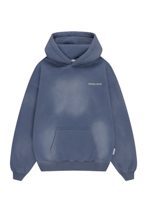 Blue oversized hoodie with front kangaroo pocket and small "ANOTHER COTTON" text on the chest, ribbed cuffs, and hem.