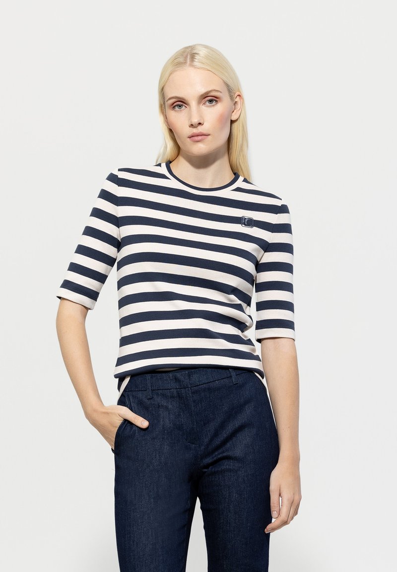 Navy and cream striped t-shirt with elbow-length sleeves and a round neckline, featuring a small logo on the left chest pane.