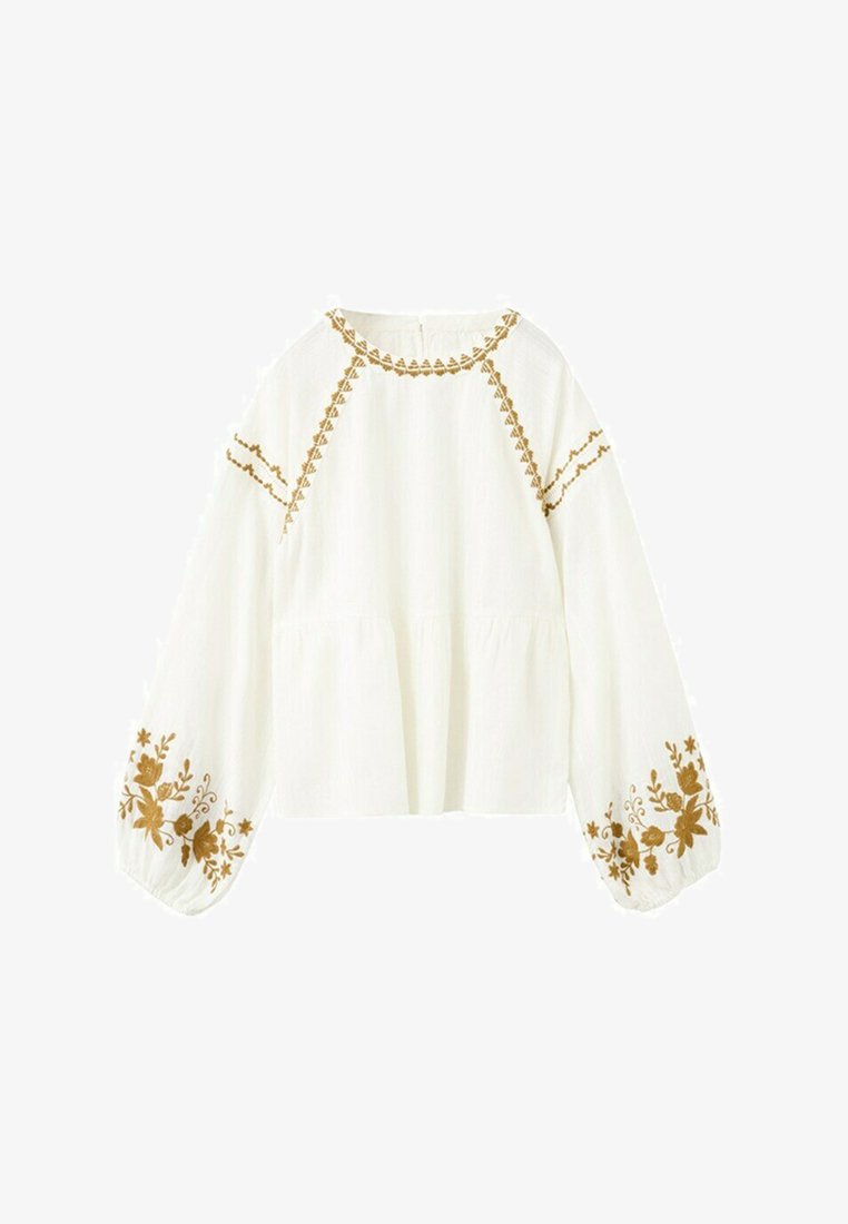 Bílá halenka s dlouhými rukávy se zlatou květinovou výšivkou na rukávech, límci a horní části hrudi, s kulatým výstřihem a volným střihem.