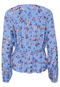 Blusa azzurro chiaro con maniche lunghe, caratterizzata da una stampa floreale in viola e beige. Vita elasticizzata e dettagli arricciati sul retro.