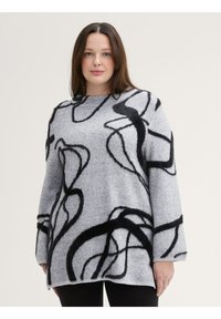 Pull gris en matériau doux, avec des motifs abstraits noirs en tourbillon, des manches longues et un col bateau. Léger et à coupe décontractée.