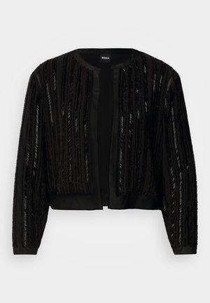 Casaco preto cropped com riscas verticais texturizadas em lantejoulas, frente aberta e mangas longas, com um design elegante e sofisticado.