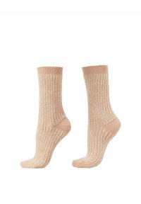 Calze beige a coste con altezza media al polpaccio. Tessuto morbido, tallone e punta rinforzati, e bordo elastico confortevole nella parte superiore.