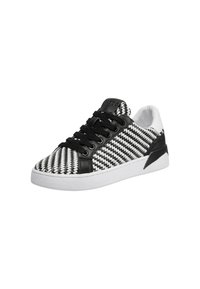 Sneaker in bianco e nero con motivo a zigzag, parte superiore tessuta con texture, accenti neri solidi e suola in gomma bianca. Design con lacci e collare imbottito.