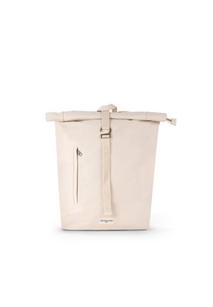 Canvas tote bag in beige, featuring a roll-top closure, adjustable strap, a side zip pocket, and a branded label at the front.