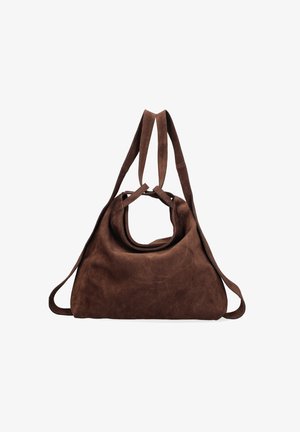 Sac en bel velours marron avec une poignée originale en forme d'ovale, texture douce et longues anses. Il présente un design spacieux et minimaliste sans aucune quincaillerie visible.