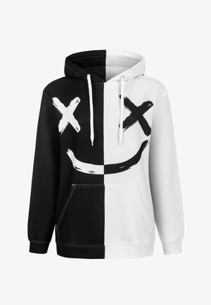Kapuzensweatshirt mit einem gespaltenen Schwarz-Weiß-Design und großen X- und Smile-Motiven. Hergestellt aus weichem Stoff mit Kängurutasche.