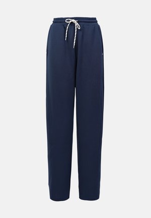 Navy blauwe sweatpants van zacht materiaal, met een elastische tailleband met een trekkoord en twee zijzakken. Recht pijp ontwerp.