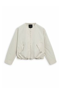 Lys beige cropped jakke med frontlynlås, kravefri halsudskæring, lange ærmer og trykknaplommer på begge sider.