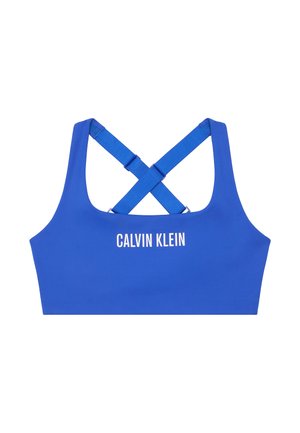 Reggiseno sportivo blu con una texture liscia, dotato di spalline incrociate sul retro. "CALVIN KLEIN" stampato in bianco sul davanti.