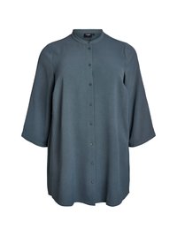 Tamnozeleni košulja s dugim rukavima i Mandarin ovratnikom, rukavi do tri četvrtine, teksturirana tkanina i opušteni kroj. Glatka površina s suptilnim prugama.