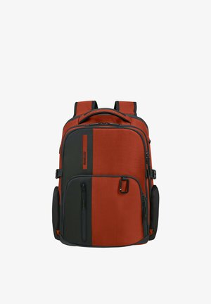 Red and black backpack with multiple zippered compartments, padded shoulder straps, top handle, and a small front clip.