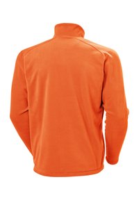 Polarowa bluza w jaskrawym pomarańczowym kolorze, z wysokim kołnierzem, długimi rękawami i gładką teksturą, o prostym kroju i bez zdobień.
