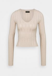 T-shirt beige à manches longues avec un décolleté en V profond et un ourlet cropped. Texture douce avec des rayures horizontales et une finition à bord festonné.
