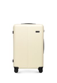 Hard-shell koffer in crème met verticale ribbels, zwarte accenten en vier zwarte wielen voor gemakkelijke mobiliteit. Voorzien van een handvat bovenop.