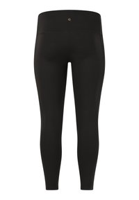 Zwarte leggings van rekbare stof, met een hoge taille en een slank ontwerp. Subtil gouden logo detail aan de achterkant in het midden.