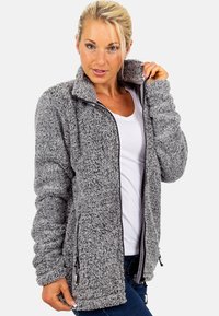 Grey fleece jacket with a zip front, high collar, and two side pockets. Features a textured, cozy fabric and fitted cuffs.