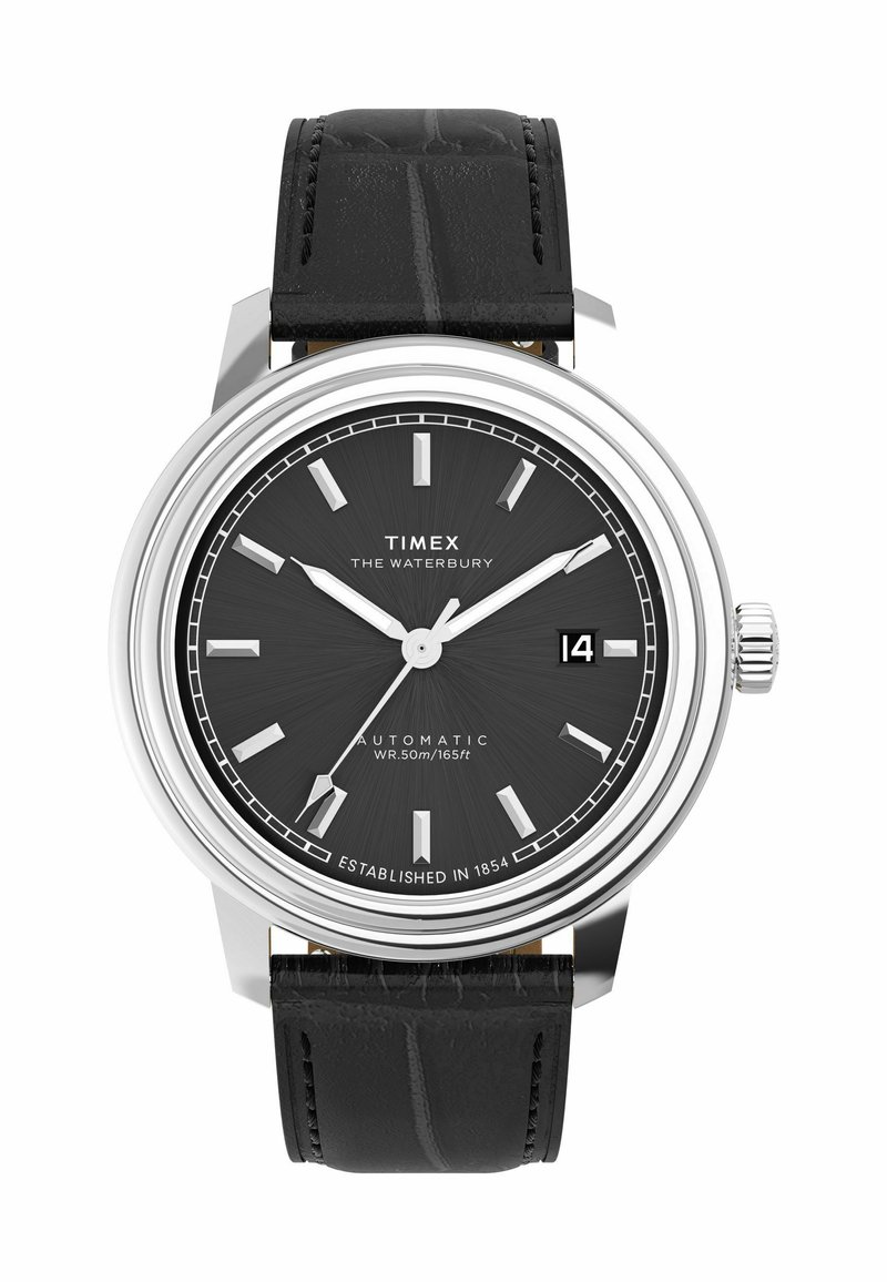 Timex Waterbury automatic watch with a black textured leather strap, silver casing, and black dial featuring silver hour markers and a date display.