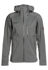 Veste imperméable grise avec capuche, fermeture éclair intégrale à l'avant, poches poitrine et latérales zippées, et logos Mammut sur la poitrine et la manche gauche.