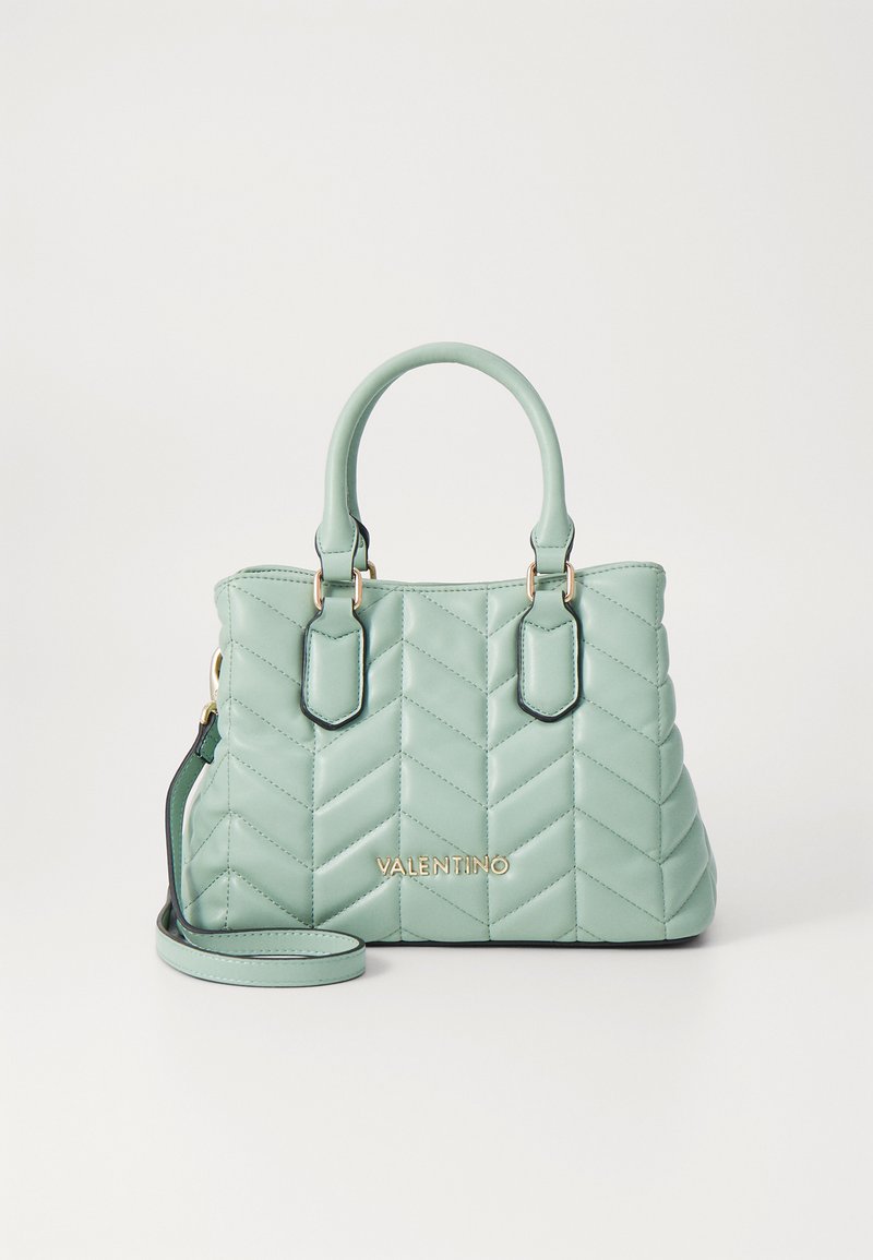 Világos menta zöld, steppelt kézitáska cikk-cakk mintával, dupla felső fogantyúval, levehető vállpánttal és arany logó részlettel.