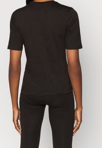 Puma T-shirt med print - black